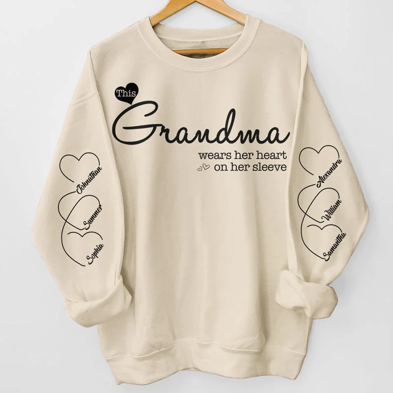 Grandma Wears Her Heart On Her Sleeve - Family Personalized Custom Unisex Sweatshirt With Design On Sleeve - Christmas Gift For Mom, Grandma